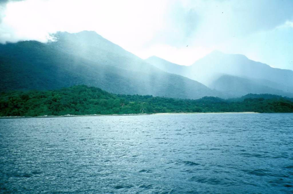Panoramic view of Lake Tanganyika with clear blue waters and green hills in the background