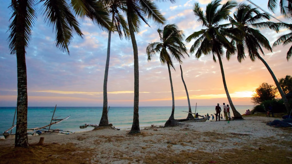 Sunrise over Kizimkazi Beach with soft golden light reflecting on the water