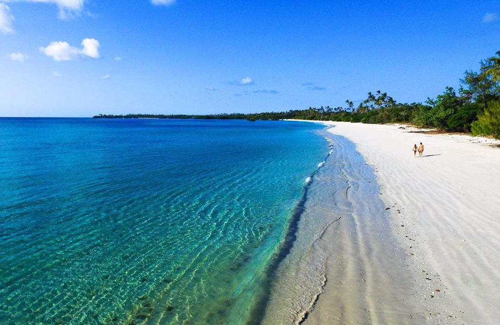 Aerial view of Mafia Island showing lush green landscapes surrounded by turquoise Indian Ocean waters