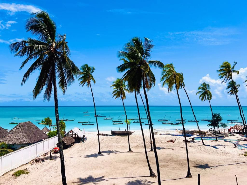 Nungwi Beach with white sand and turquoise waves on the northern coast of Zanzibar